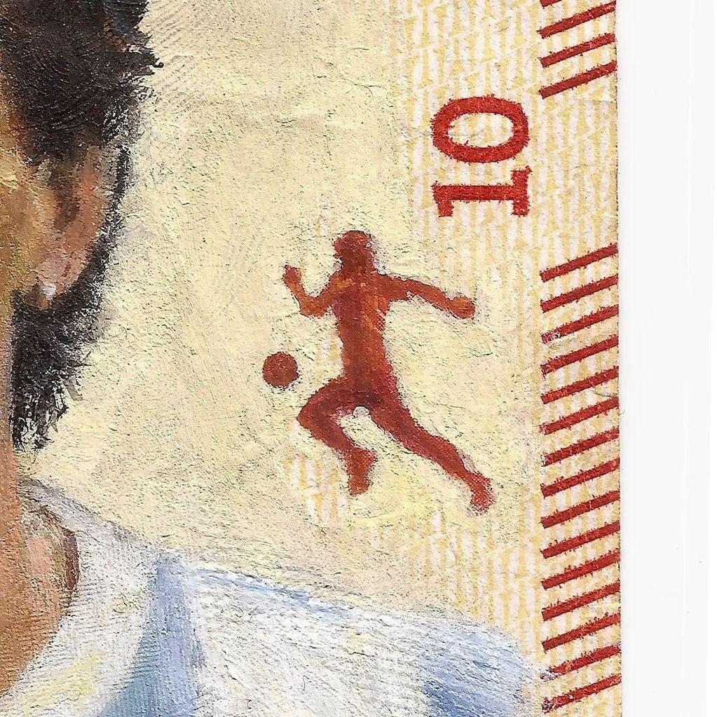 Un artista plástico pinta sobre billetes personajes icónicos de la historia y el entretenimiento