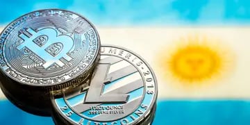 coins Bitcoin and litecoin, against the background of Argentina flag, concept of virtual money, close-up. Conceptual image.