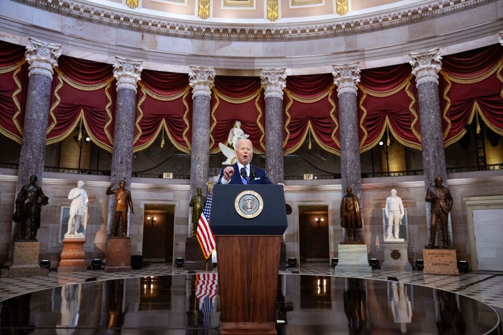 WASHINGTON, DC - JANUARY 06: U.S. President Joe Biden delivers remarks on the one year anniversary of the January 6 attack on the U.S. Capitol, during a ceremony in Statuary Hall at the U.S. Capitol on January 06, 2022 in Washington, DC. One year ago, supporters of President Donald Trump attacked the U.S. Capitol Building in an attempt to disrupt a congressional vote to confirm the electoral college win for Joe Biden. (Photo by Drew Angerer/Getty Images)