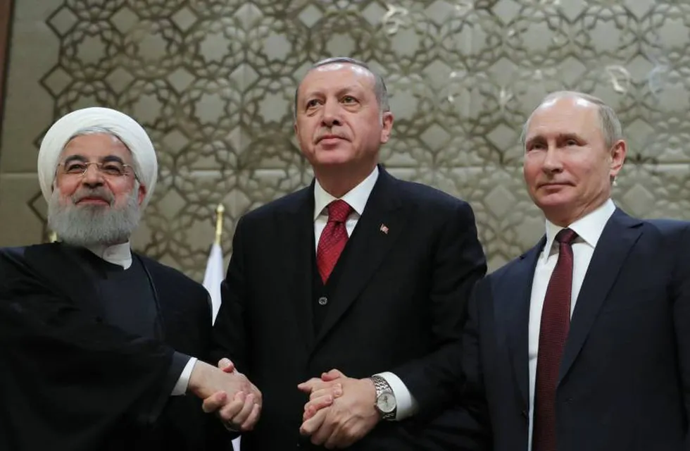 El presidente iraní, Hasan Rohaní, y sus homólogos turco, Recep Tayyip Erdogan, y ruso, Vladímir Putin.