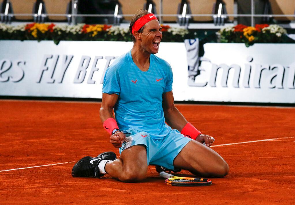 Rafa festeja su victoria número 100 en Roland Garros y su título 13 en el torneo más importante sobre polvo de ladrillo.