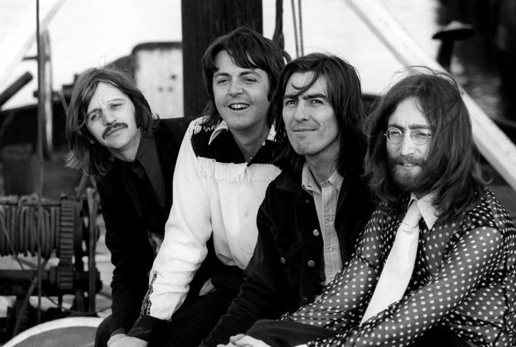 Members of the Beatles, Ringo Starr, Paul McCartney, George Harrison and John Lennon pose in Twickenham, Britain, August 9, 1969. Picture taken August 9, 1969. Bruce McBroom, Copyright Apple Corps Ltd/via REUTERS THIS IMAGE HAS BEEN SUPPLIED BY A THIRD PARTY. MANDATORY CREDIT. NO RESALES. NO ARCHIVES. FOR EDITORIAL USE ONLY IN REPORTING EVENTS OF THE ABBEY ROAD 50TH ANNIVERSARY FAN EVENT AND THE GLOBAL ANNOUNCEMENT RELATING TO THE LAUNCH OF THE 50TH ANNIVERSARY ALBUM SETS OF THE BEATLES. NO NEW USES AFTER 2359 ON DECEMBER 31, 2019. IMAGE MUST BE USED IN ITS ENTIRETY - NO CROPPING OR OTHER MODIFICATIONS.