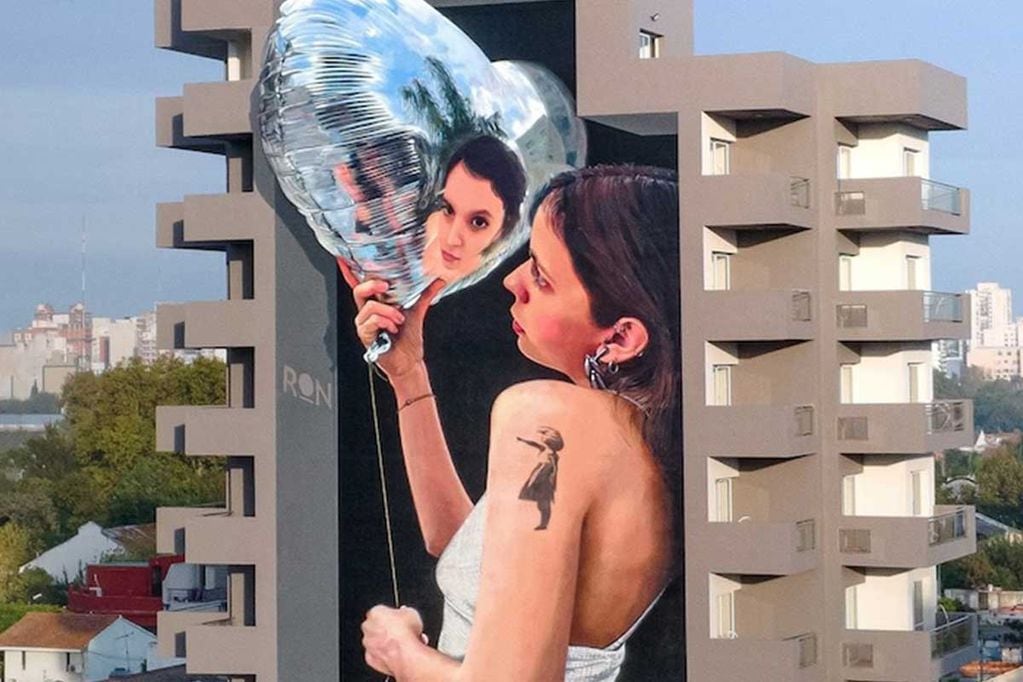 Este mural es una evocación a la obra de Bansky "Niña con globo"