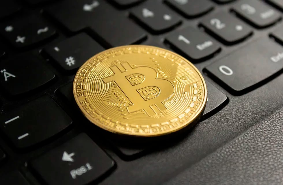 A closeup shot of a bitcoin put on a black computer keyboard