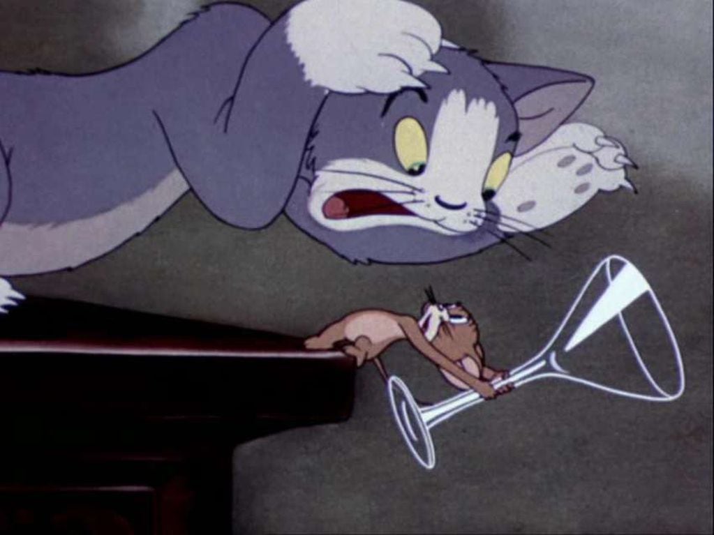 
    “Puss Gets the Boot” (1940), el primer corto. Con el paso del tiempo, la apariencia de Tom y Jerry evolucionó.
   