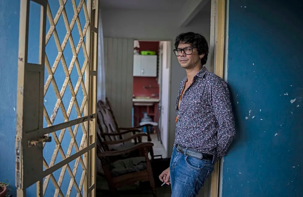 Yunior Garcia Aguilera, a playwright and one of the organizers of a protest march set for Monday, poses for a photo during an interview with The Associated Press at his home in Havana, Cuba, Friday, Nov 12, 2021. (AP Photo/Ramon Espinosa)